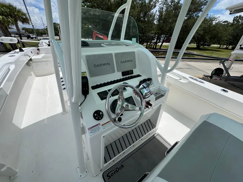 Slide: The Image of 2020 Twin Vee 310 CC GF boat console with Garmin navigation system and steering wheel. - 33