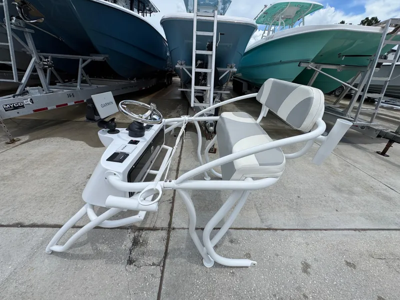 Slide: The Image of 2020 Twin Vee 310 CC GF boat console and seating on display. - 45