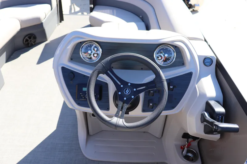 Slide: The Image of Steering console of 2025 Flagship Freedom 18 boat with modern controls and gauges. - 6