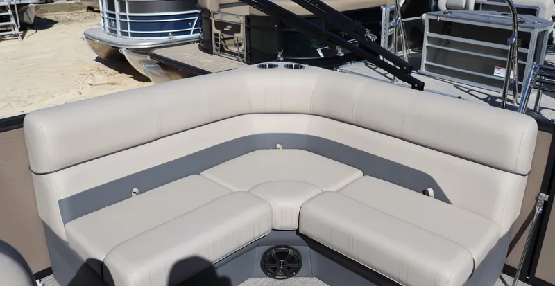 Slide: The Image of Luxurious seating on 2025 Flagship Freedom 18 pontoon boat, featuring beige upholstery. - 7