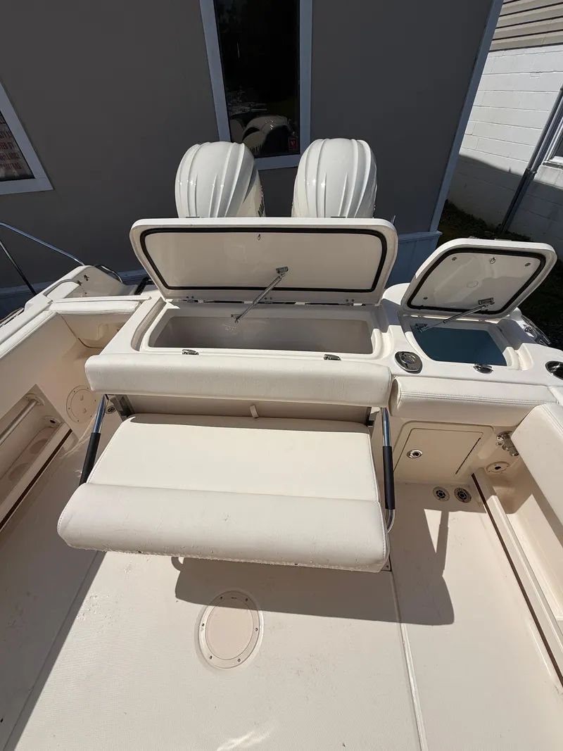 Slide: The Image of 2025 Grady-White Fisherman 257 boat interior with open storage compartments and seating. - 5