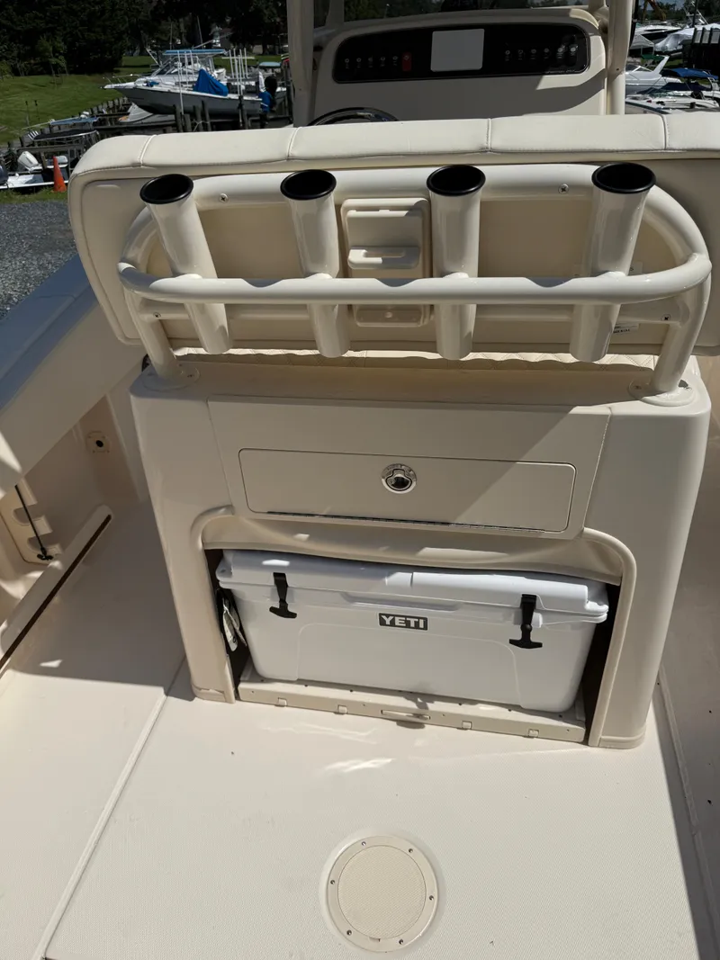 Slide: The Image of 2025 Grady-White Fisherman 257 boat with rod holders and Yeti cooler. - 6