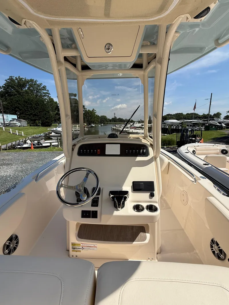 Slide: The Image of 2025 Grady-White Fisherman 257 boat interior with steering console and seating. - 7