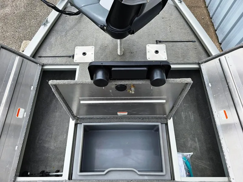 Slide: The Image of 2007 Fisher Pro Hawk 170 boat interior with storage compartments and seating. - 10