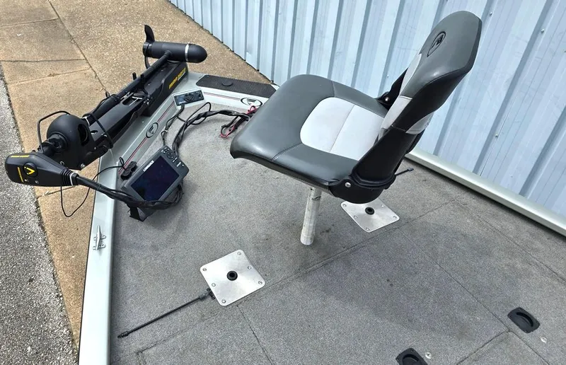 Slide: The Image of 2007 Fisher Pro Hawk 170 boat deck with seat and trolling motor. - 6