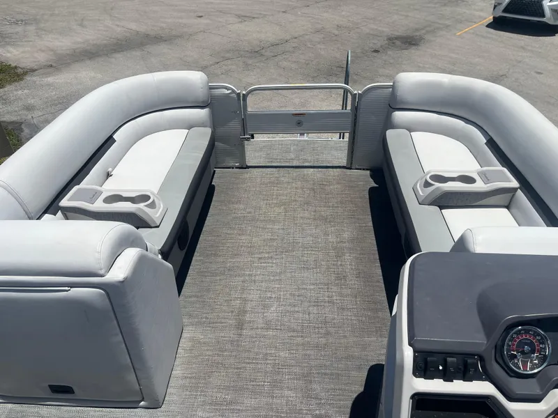 Slide: The Image of 2022 Godfrey SWEETWATER 2286 SFL pontoon boat interior with spacious seating and cup holders. - 11