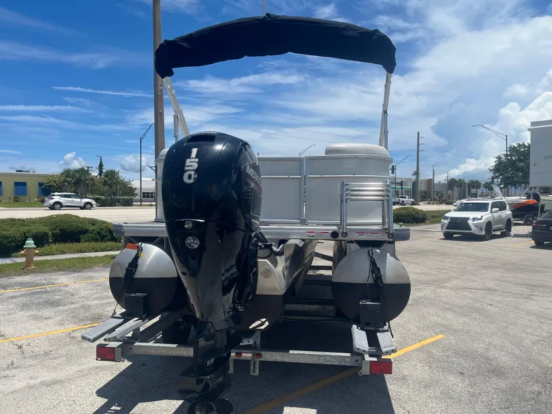 Slide: The Image of 2022 Godfrey SWEETWATER 2286 SFL pontoon boat with 150 HP engine on trailer. - 5