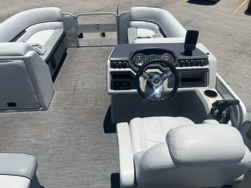Slide: The Image of 2022 Godfrey SWEETWATER 2286 SFL pontoon boat interior with steering console and seating. - 6