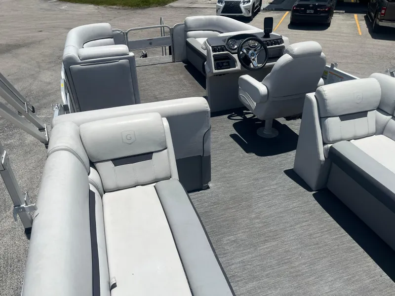 Slide: The Image of 2022 Godfrey SWEETWATER 2286 SFL pontoon boat interior with plush seating and modern dashboard. - 7
