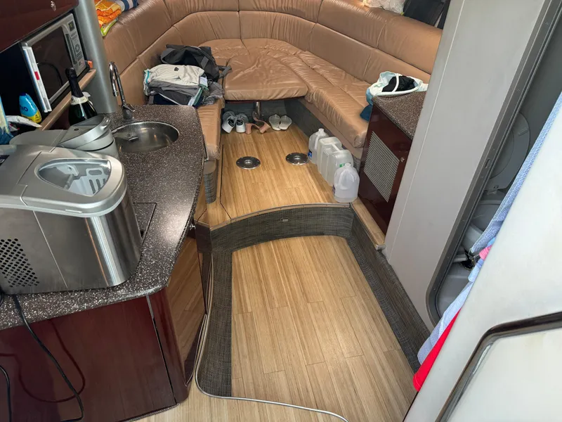 Slide: The Image of Interior of 2006 Formula 370 SS boat with kitchenette and seating area. - 10