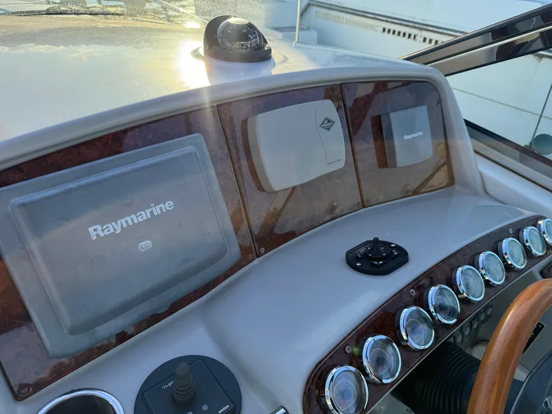 Slide: The Image of Dashboard of a 2006 Formula 370 SS boat with Raymarine navigation equipment. - 7