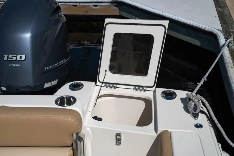 Slide: The Image of Manufacturer Provided Image: 2021 Scout 215 Dorado boat with Yamaha 150 engine and open storage compartment. - 11
