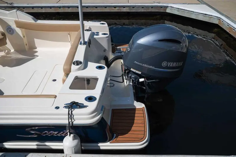 Slide: The Image of Manufacturer Provided Image: 2021 Scout 215 Dorado boat with Yamaha outboard motor docked. - 12