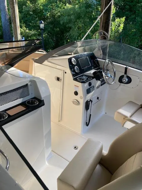 Slide: The Image of 2021 Scout 215 Dorado boat interior with modern dashboard and seating. - 20