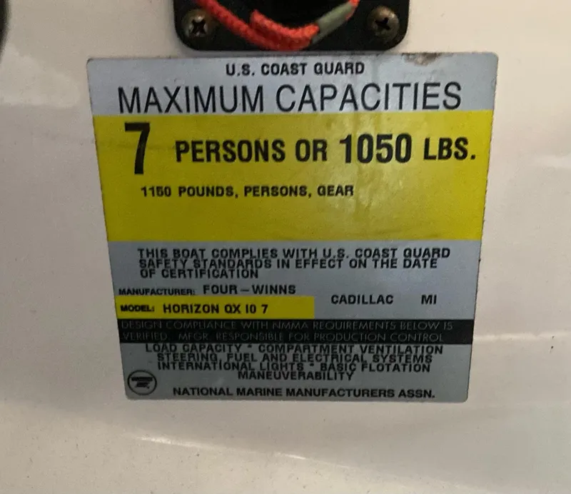 Slide: The Image of 1998 Four Winns Horizon QX capacity label: 7 persons or 1050 lbs, U.S. Coast Guard compliant. - 12