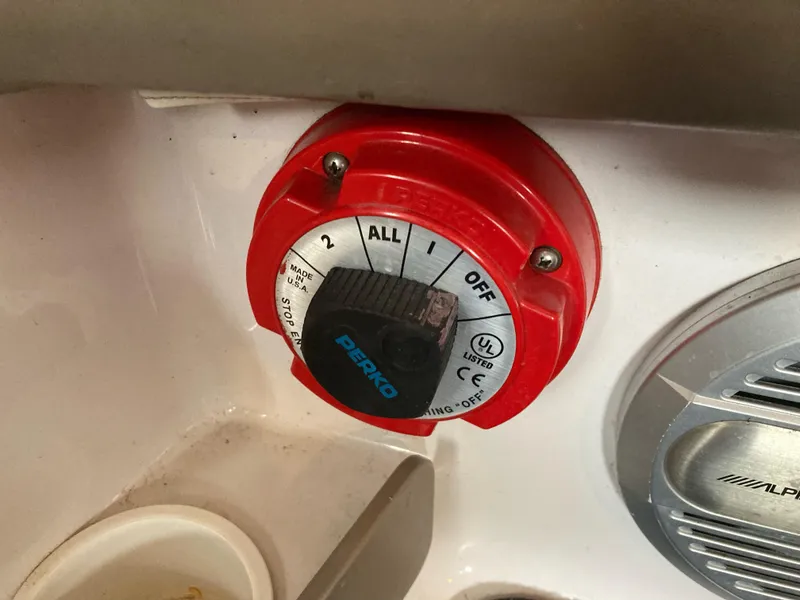 Slide: The Image of Red Perko battery switch on 1998 Four Winns Horizon QX boat. - 14