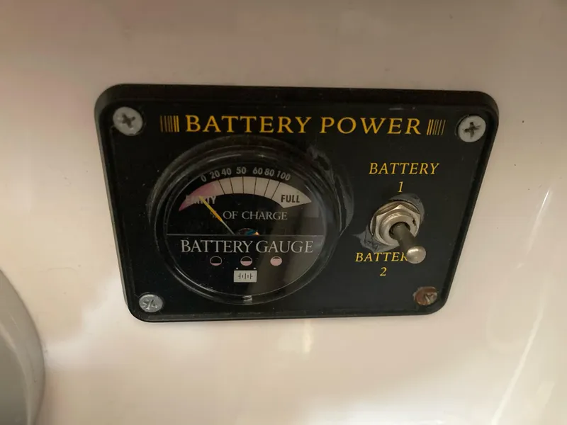 Slide: The Image of Battery gauge panel on 1998 Four Winns Horizon QX boat, showing charge levels and switch. - 15