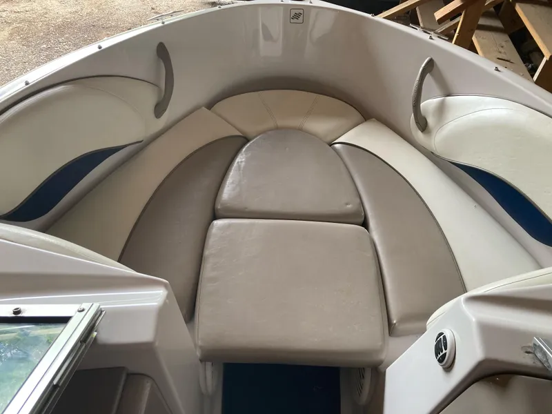 Slide: The Image of 1998 Four Winns Horizon QX boat interior with cushioned seating area. - 8