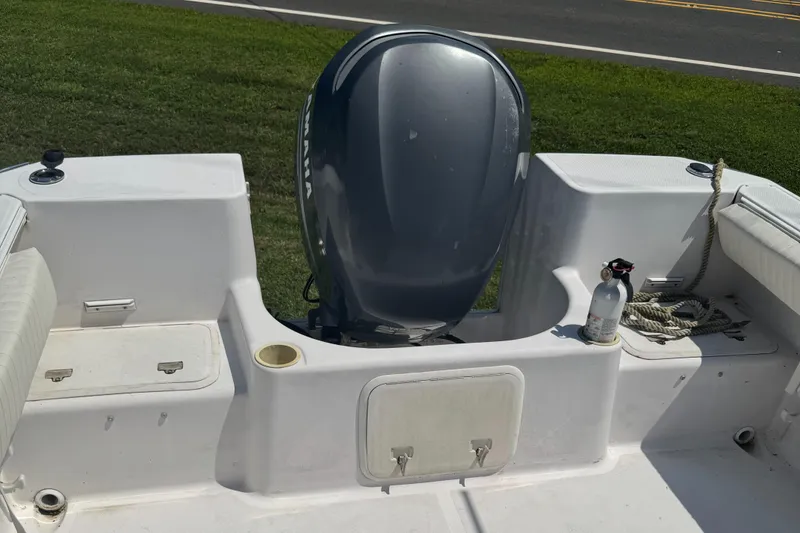 Slide: The Image of 2002 Pro-Line 22 Sport Center Console boat with Yamaha outboard motor and deck storage. - 6