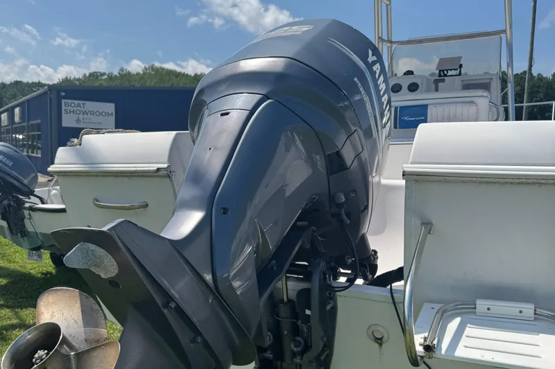 Slide: The Image of 2002 Pro-Line 22 Sport Center Console with Yamaha outboard at boat showroom. - 7