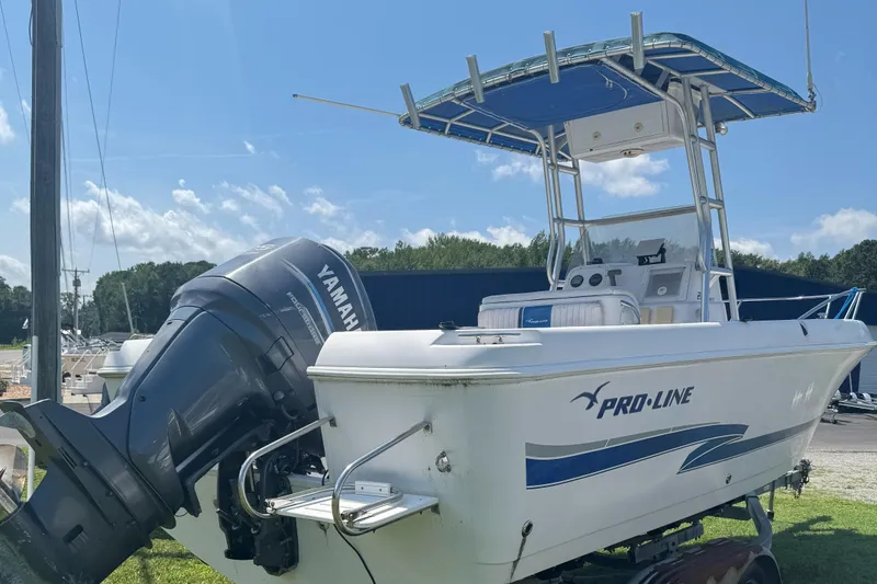 Slide: The Image of 2002 Pro-Line 22 Sport Center Console boat with Yamaha outboard motor. - 8