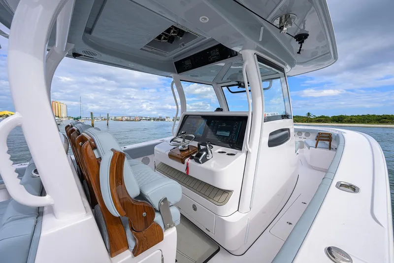 Slide: The Image of 2026 Phenom 37 Center Console boat interior with advanced navigation system and luxurious seating. - 19