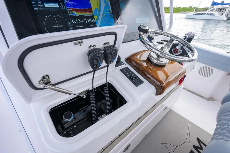 Slide: The Image of 2026 Phenom 37 Center Console boat dashboard with advanced navigation and communication equipment. - 22