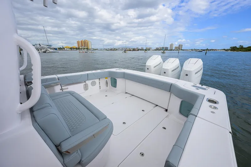 Slide: The Image of 2026 Phenom 37 Center Console boat with spacious seating and triple Mercury engines. - 24