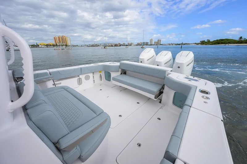 Slide: The Image of 2026 Phenom 37 Center Console boat with spacious seating and powerful engines on the water. - 25