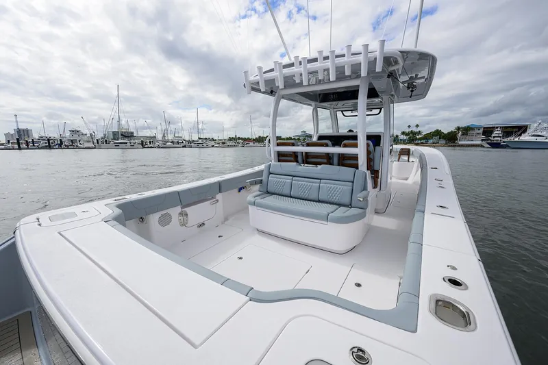 Slide: The Image of 2026 Phenom 37 Center Console boat docked, featuring spacious seating and sleek design. - 27