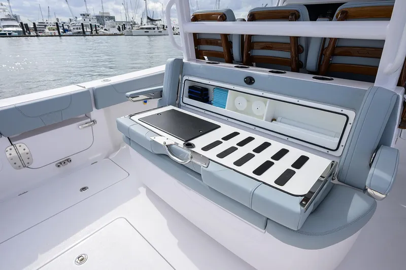 Slide: The Image of 2026 Phenom 37 Center Console boat interior with open storage compartment and seating. - 28