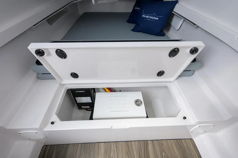 Slide: The Image of Interior storage compartment of 2026 Phenom 37 Center Console boat. - 35