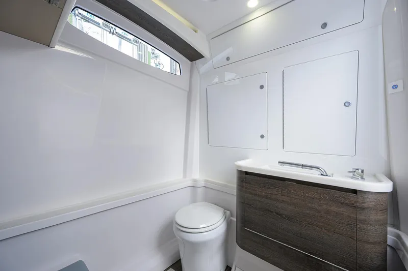 Slide: The Image of Modern bathroom interior in 2026 Phenom 37 Center Console boat. - 39