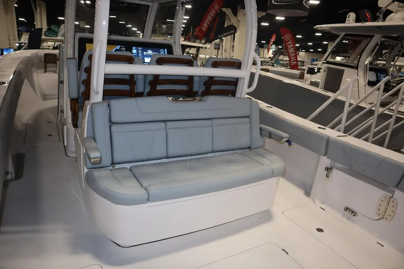 Slide: The Image of 2026 Phenom 37 Center Console boat on water near tropical beach. - 4