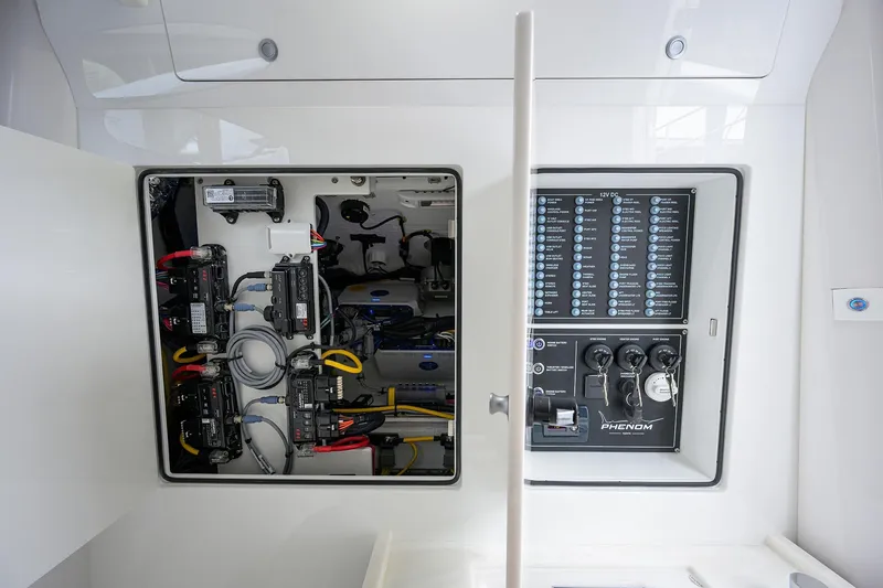 Slide: The Image of Electrical panel of 2026 Phenom 37 Center Console boat, showcasing wiring and controls. - 40