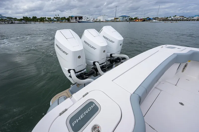Slide: The Image of 2026 Phenom 37 Center Console boat with triple Mercury outboard engines. - 41