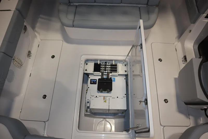 Slide: The Image of 2026 Phenom 37 Center Console boat cruising on calm waters near a tropical shoreline. - 6