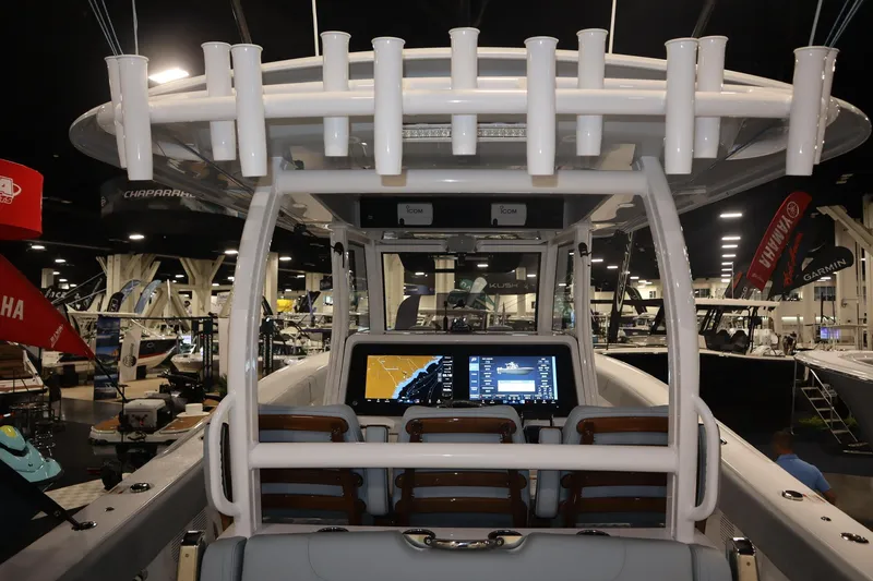 Slide: The Image of Luxurious 2026 Phenom 37 Center Console boat with spacious seating on calm waters. - 9