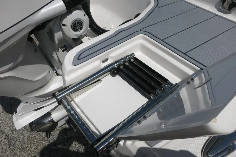 Slide: The Image of 2025 Chaparral 270 OSX boat with swim platform and retractable ladder. - 12