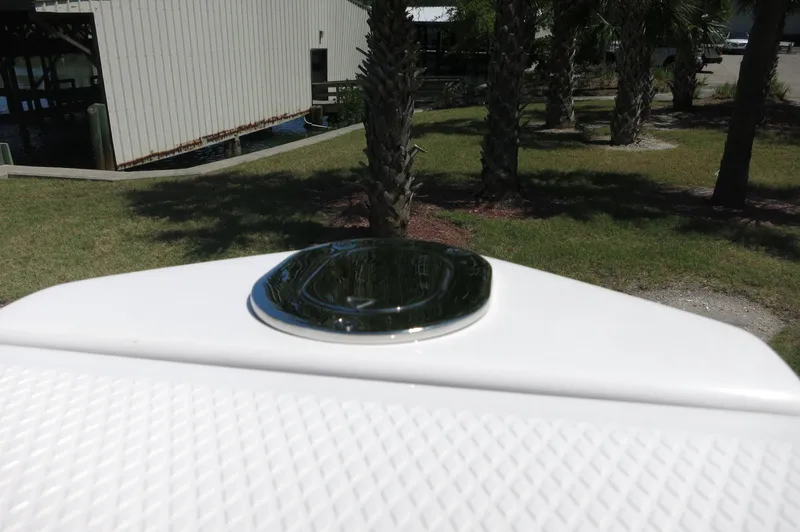 Slide: The Image of 2025 Chaparral 270 OSX boat detail with chrome accent, outdoor setting. - 15