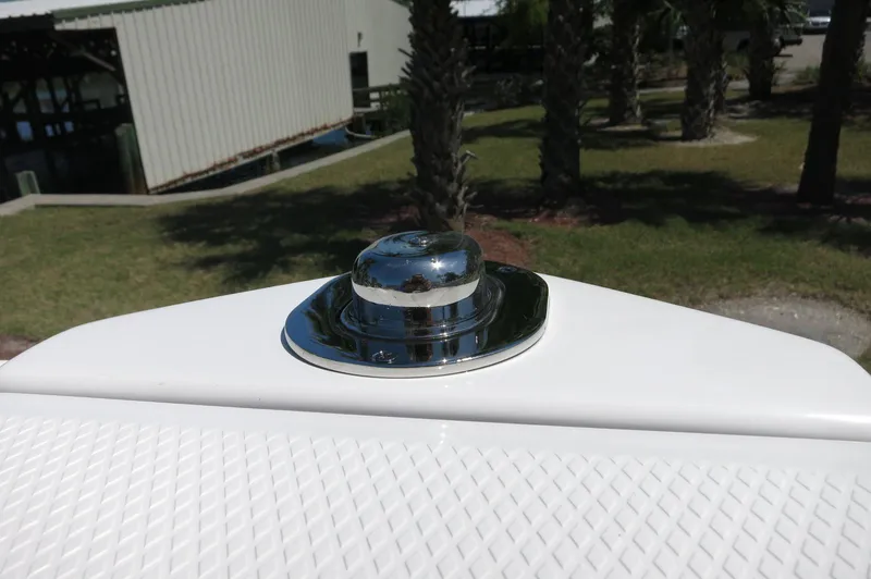 Slide: The Image of Chrome cleat on 2025 Chaparral 270 OSX boat deck, with textured surface. - 16