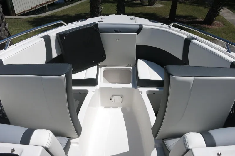 Slide: The Image of 2025 Chaparral 270 OSX boat interior with white and black seating arrangement. - 20