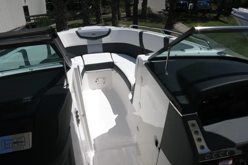 Slide: The Image of 2025 Chaparral 270 OSX boat interior with sleek seating and modern dashboard. - 21
