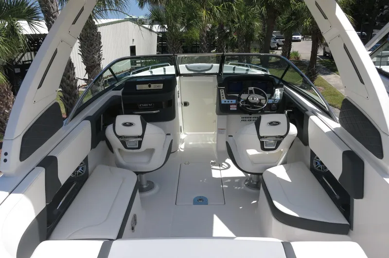 Slide: The Image of 2025 Chaparral 270 OSX boat interior with modern seating and steering console. - 37