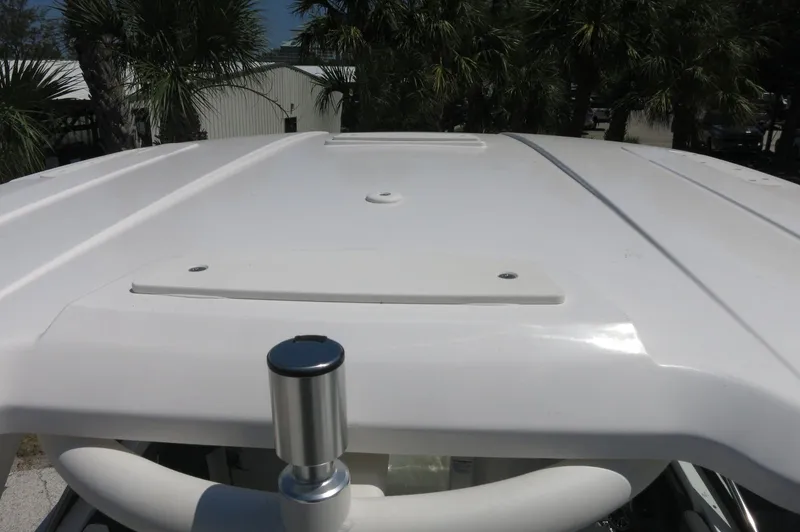 Slide: The Image of Rooftop view of 2025 Chaparral 270 OSX boat with sleek white design. - 38