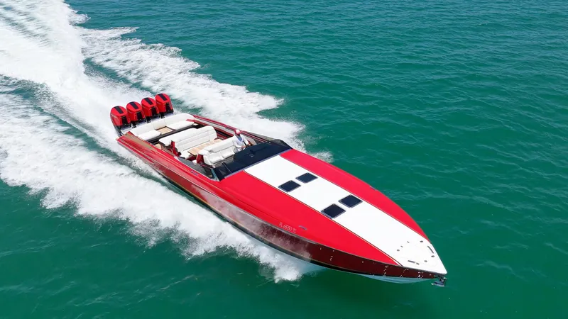 The Image of 2023 Nor-Tech 55 Flyer speedboat cruising on open water, featuring a sleek red and white design. - 0