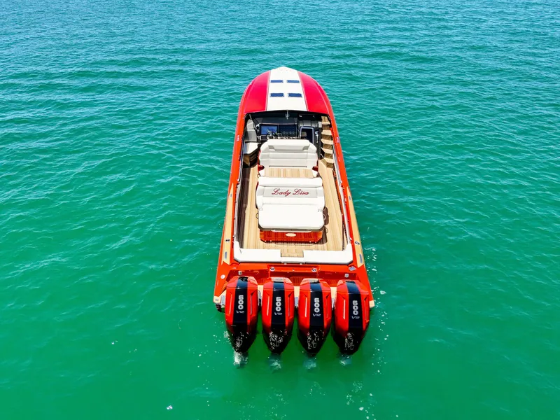 Slide: The Image of 2023 Nor-Tech 55 Flyer boat with four engines on turquoise water. - 10
