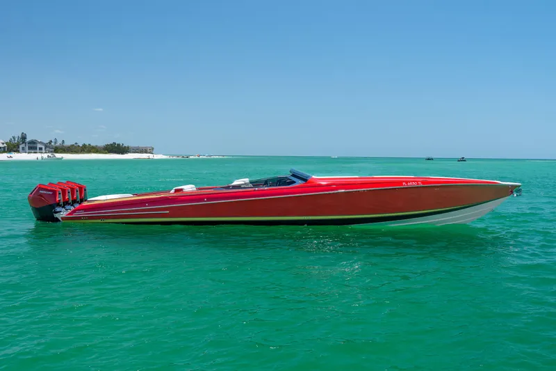 Slide: The Image of 2023 Nor-Tech 55 Flyer speedboat in vibrant red on turquoise water. - 15