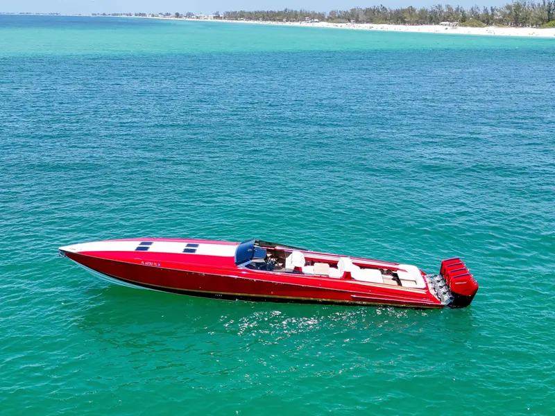 Slide: The Image of 2023 Nor-Tech 55 Flyer speedboat on turquoise ocean near sandy beach. - 17