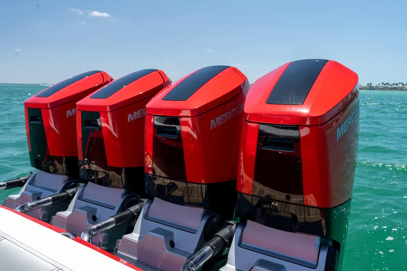 Slide: The Image of Four red Mercury outboard engines on a 2023 Nor-Tech 55 Flyer boat. - 25